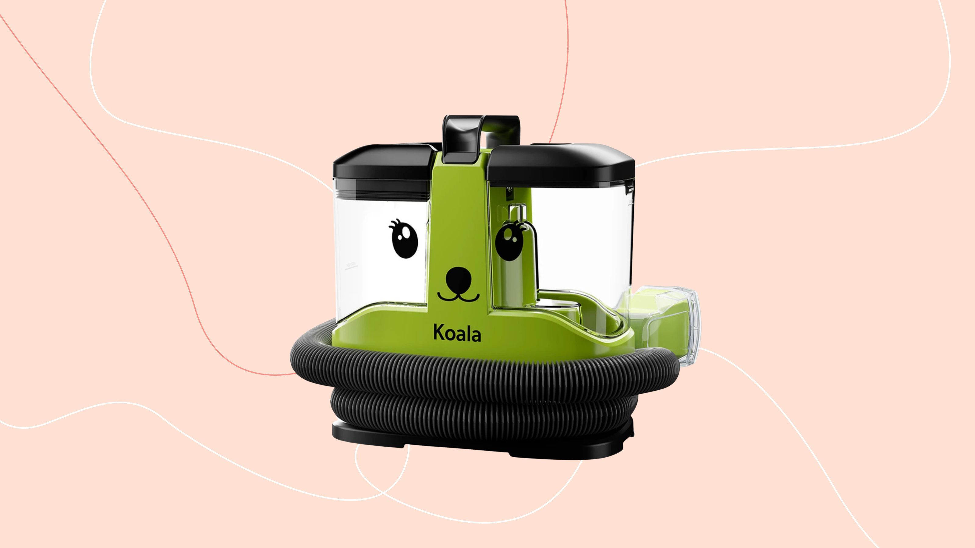 Gtech Koala spot cleaner on a pink background