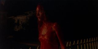 Sissy Spacek as Carrie White covered in blood walking home in Carrie