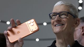 Tim Cook holding up an iPhone 17 Pro Max at launch event