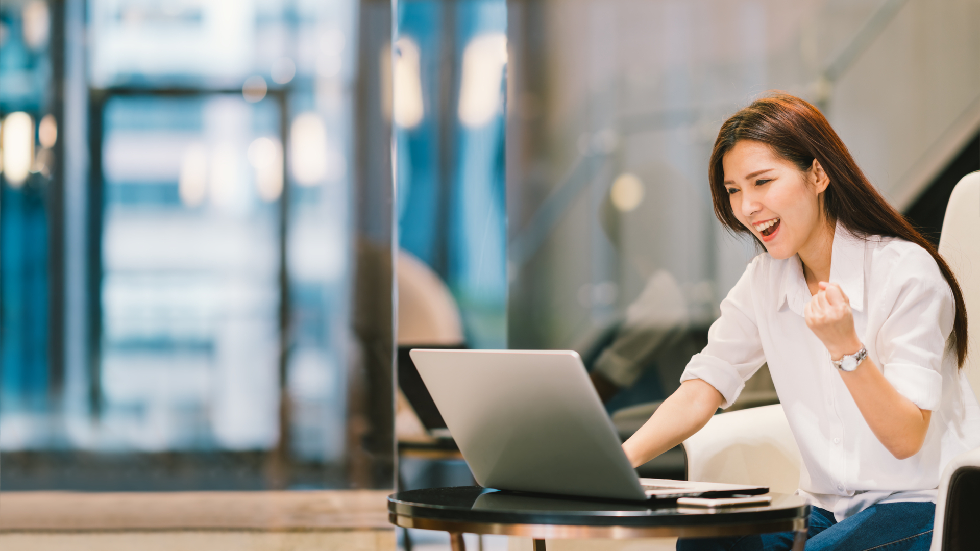 Happy woman using a laptop