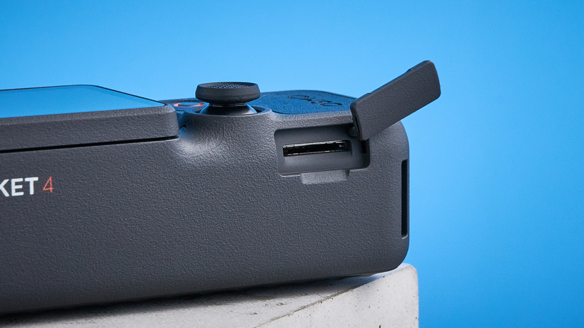 DJI Osmo Pocket 4 against a blue background