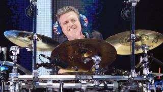 Def Leppard drummer, Rick Allen sat at drum kit