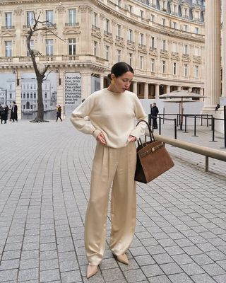 French Outfit Updates: @melodiebanfield wears cream satin trousers with a cream jumper