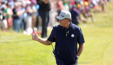 Phil Mickelson sticks his thumb up to the crowd