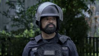 Isaac in full FEDRA uniform and helmet in The Last of Us Season 2 flashback