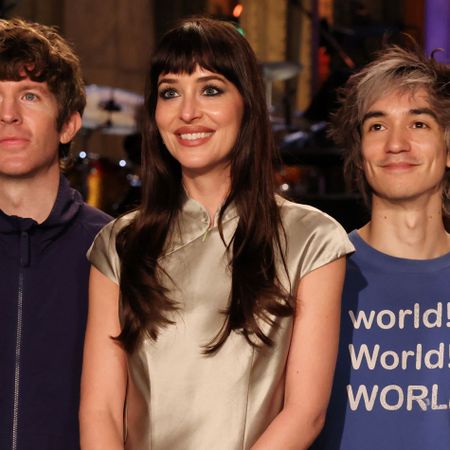 Dakota Johnson hosts SNL wearing a satin miniskirt