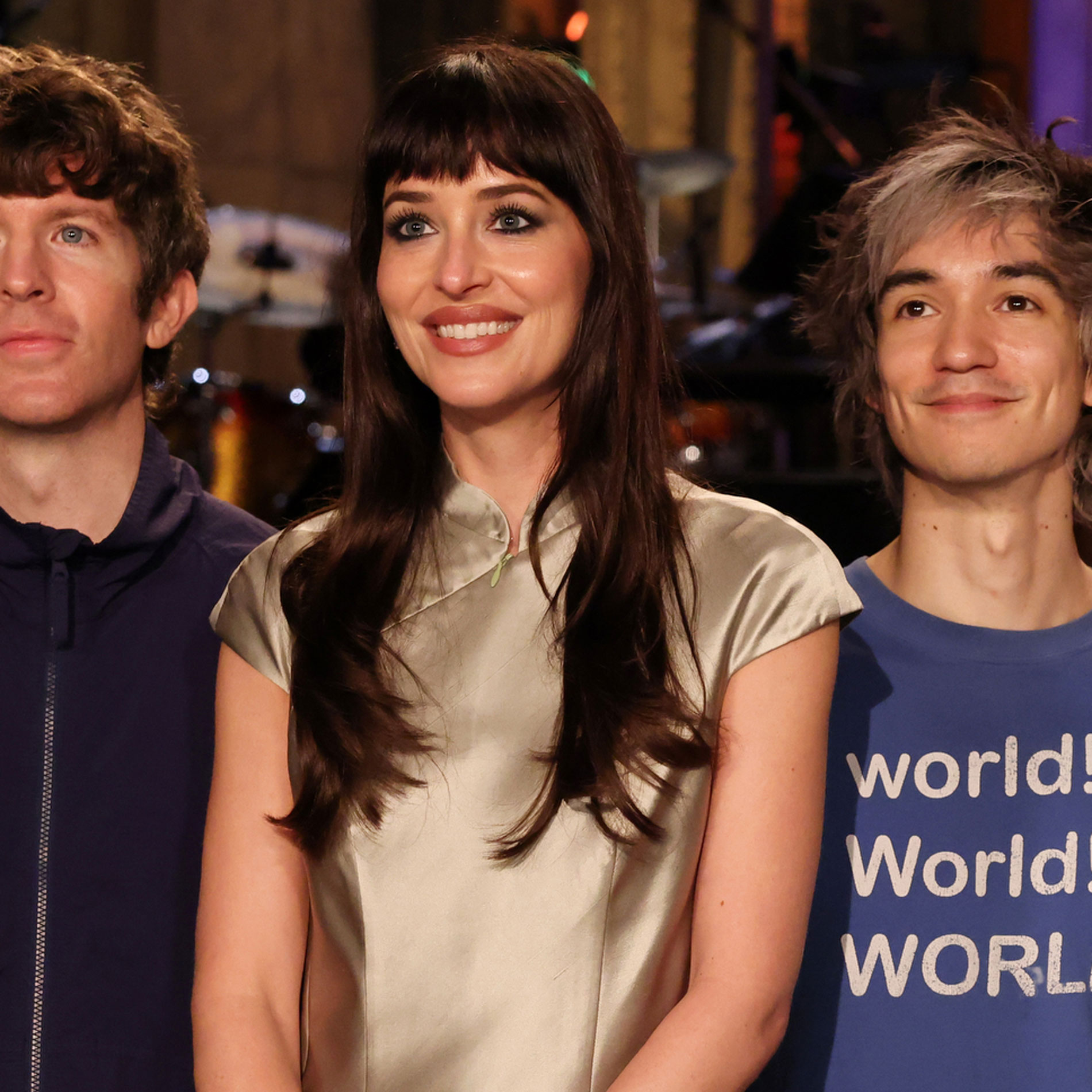 Dakota Johnson hosts SNL wearing a satin miniskirt