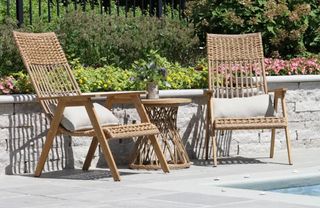 A pair of wicker outdoor chairs