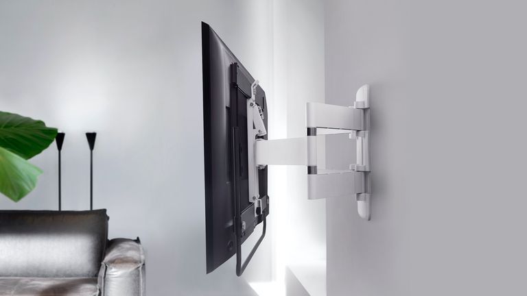 Best TV wall mount 2022, image shows side view of TV fixed to wall with wall mount