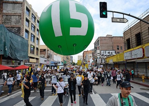 Protesters call for a minimum wage of $15 an hour.