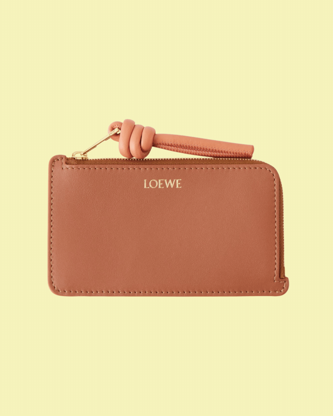 LOEWE Knot Leather Cardholder in recurring gif against pale yellow background.
