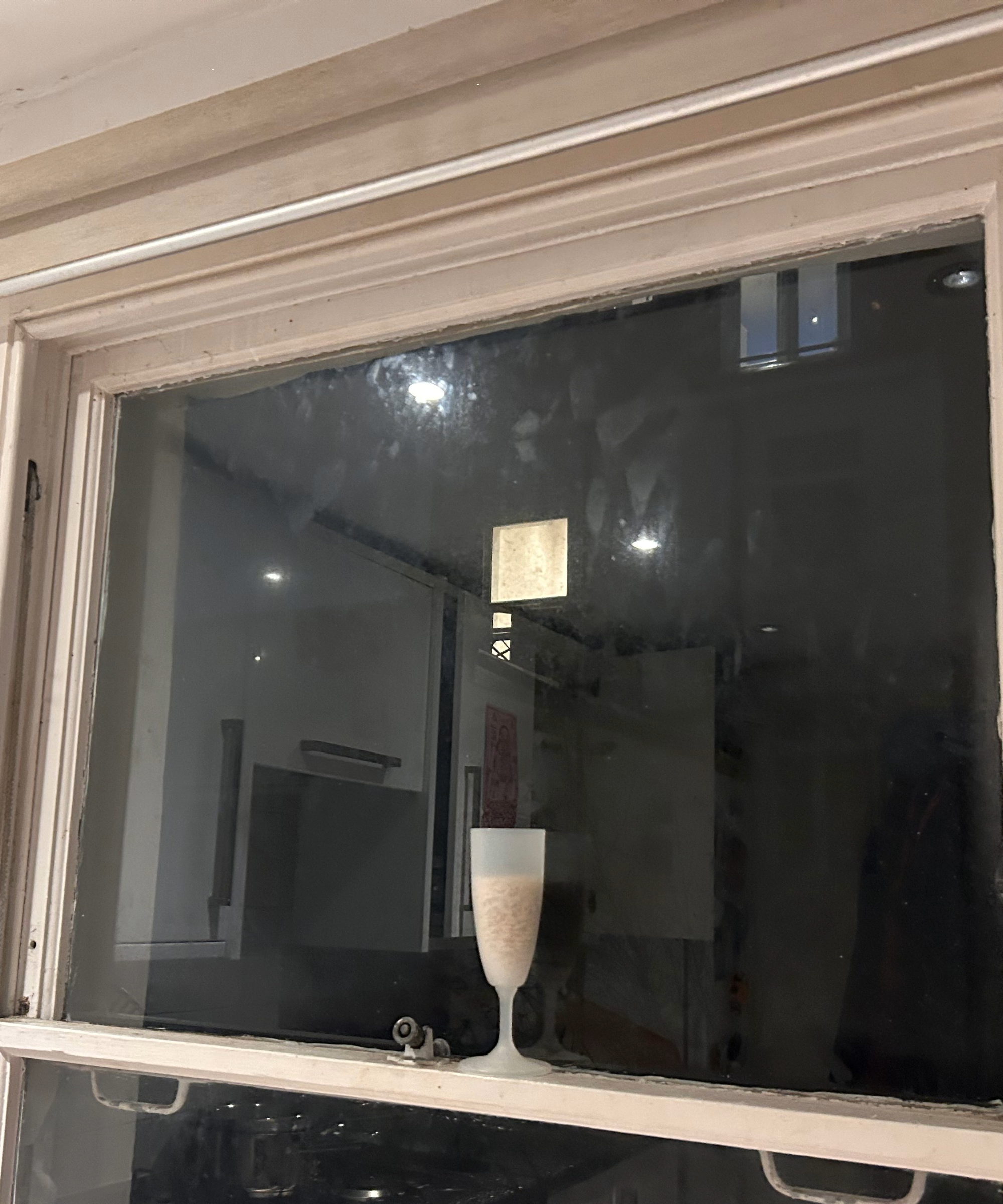 Cup of rice on a window ledge