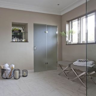 bathroom with footstools and walled storage area