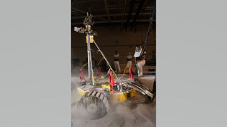 a tall rover churns up dust