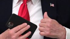 Donald Trump pockets his phone