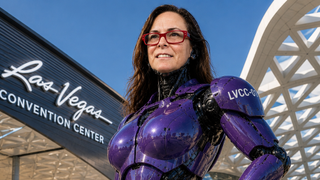 Cindy Davis in an AI-created purple superhero suit in front of the Las Vegas Convention Center.