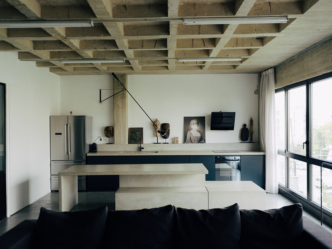 1OAM lofts interiors, midcentury furniture and raw brutalist concrete surfaces