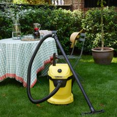 Karcher wet and dry vacuum cleaner infront of green table 