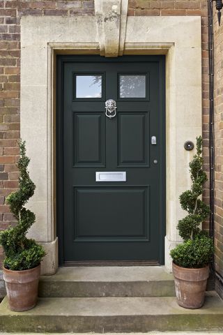 Georgian front door with limestone threshold and smart black door