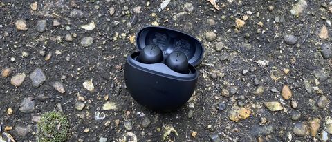 the 1more comfobuds mini wireless earbuds in their charging case
