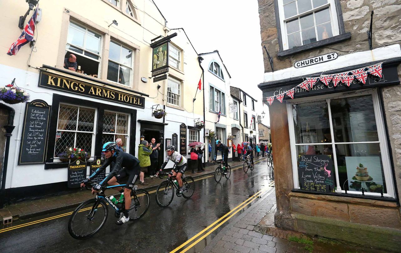 Luke Rowe leads world champion Mark Cavendish through the town of Kirkby Lonsdale at the 2012 Tour of Britain.