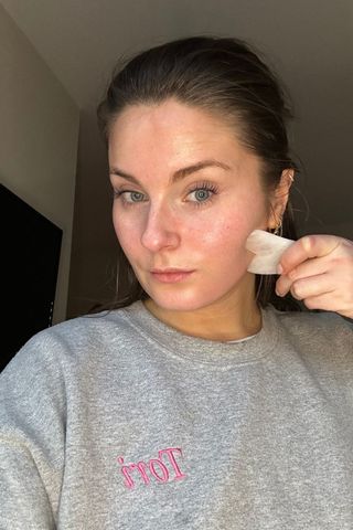 Gua Sha routine - Tori Crowther showing how to use the Gua Sha tool to glide along the jawline until the tool reaches the ear