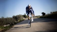 Mathieu van der Poel riding on a sunny dry road 