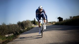 Mathieu van der Poel riding on a sunny dry road 