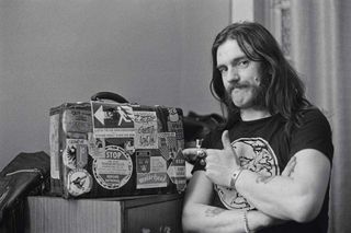 Lemmy backstage with a suitcase