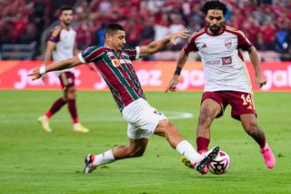 Liverpool target Andre Trindade of Fluminense (L) plays against Hussein Elshahat of Al Ahly (R) during FIFA Club World Cup Saudi Arabia Semi-Final match between Fluminense and Al Ahly FC at King Abdullah Sports City on December 18, 2023 in Jeddah, Saudi Arabia. (Photo by Marcio Machado/Eurasia Sport Images/Getty Images)