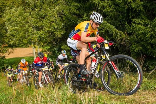 Race leader Christoph Sauser chases uphill