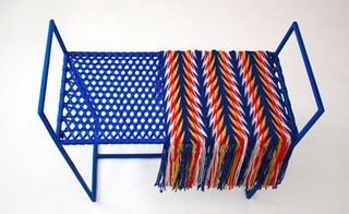 Blue bench with throw on
