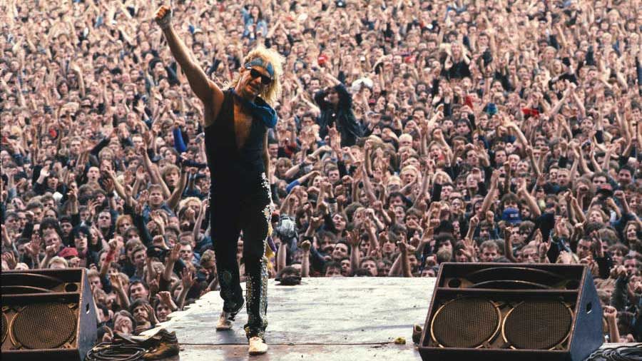 David Lee Roth on the ramp at Donington 1988, arm aloft