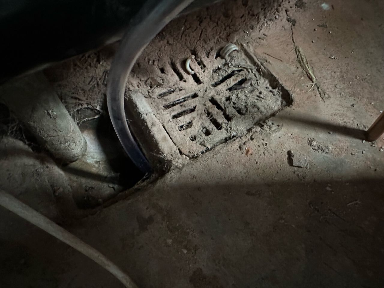 The water drainage tube from the dehumidifier inserted into a drain