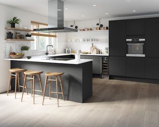 A large kitchen layout idea with dark gray units, white walls and a breakfast bar.
