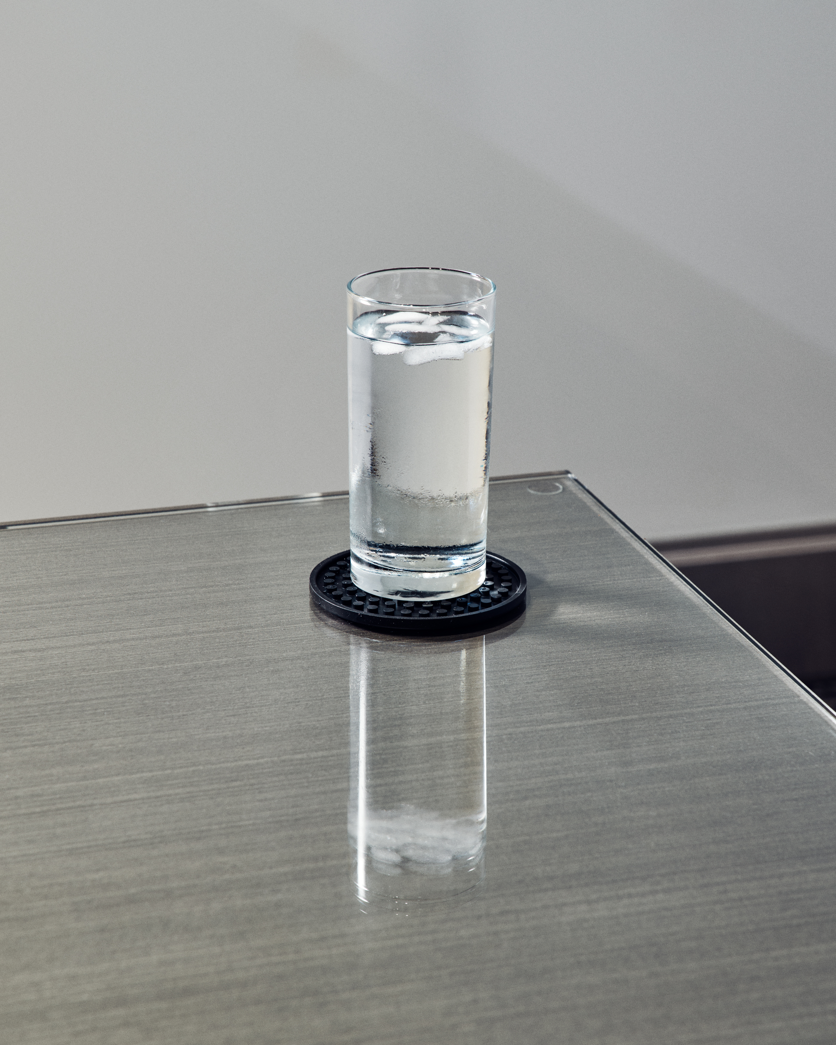 photography of water glass on table