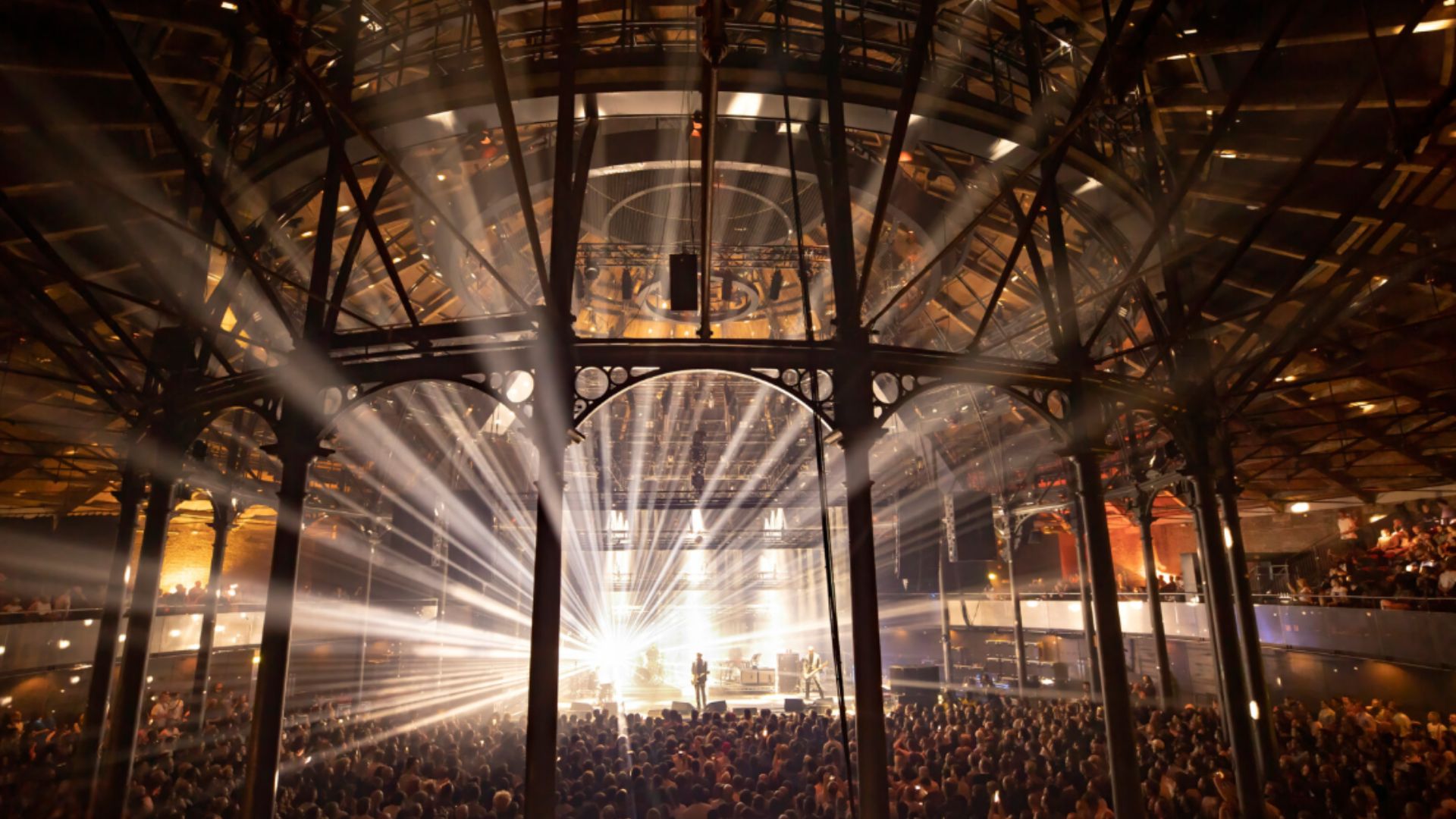 an image of the interiors of Roundhouse in London where a music gig is in full swing