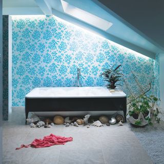 bathroom with coral print wall bathtub and sea urchins