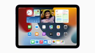 A photo of the homepage of an iPad Mini, showing the iPadOS software.