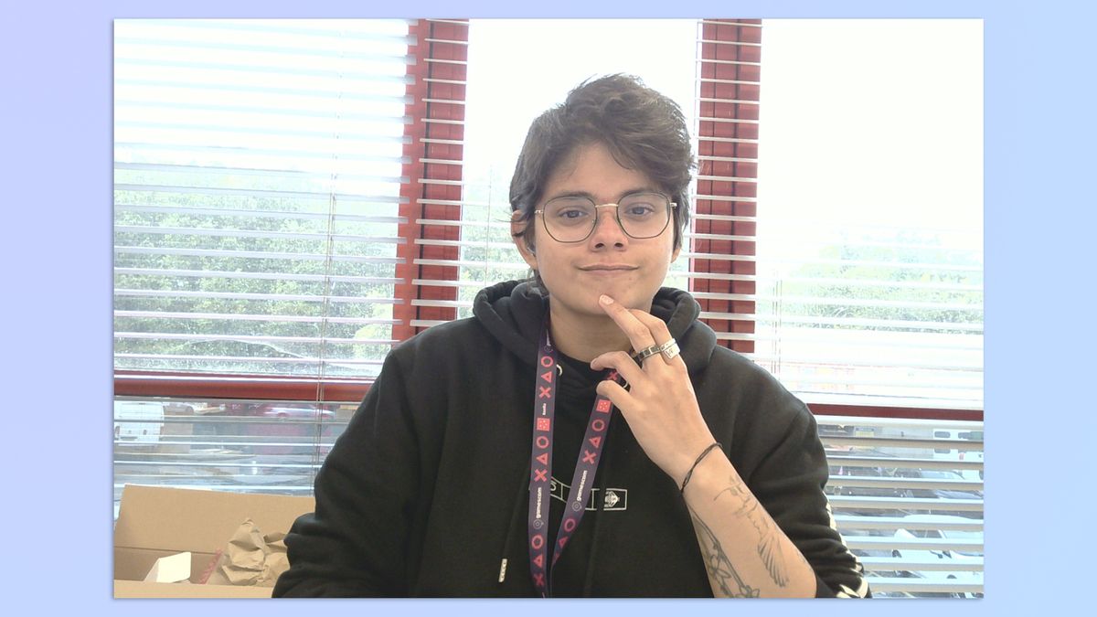 A woman with short hair sitting in an office, taken with a BenQ ideaCam S1 Plus webcam