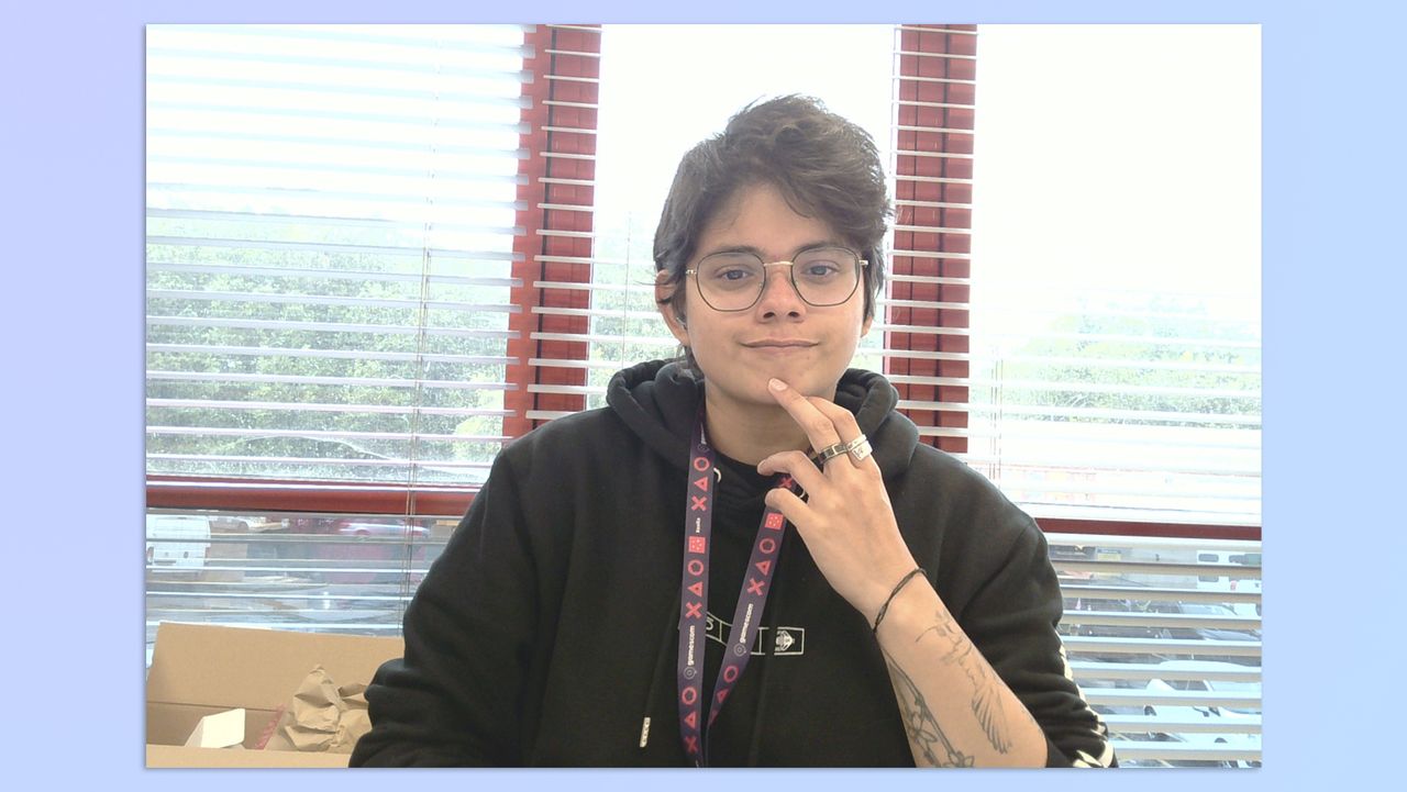 A woman with short hair sitting in an office, taken with a BenQ ideaCam S1 Plus webcam