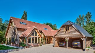 oak frame house with clay roof and slate roof car port