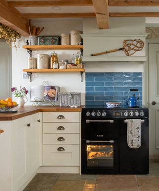 black range cooker in a cream cottage kitchen