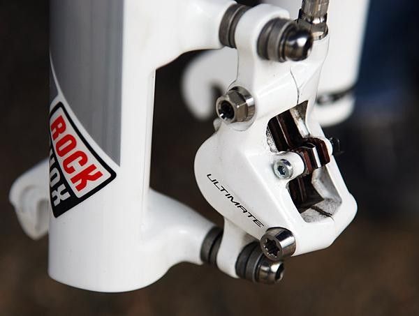 The new two-piece calliper is likely magnesium and is held together with titanium hardware.