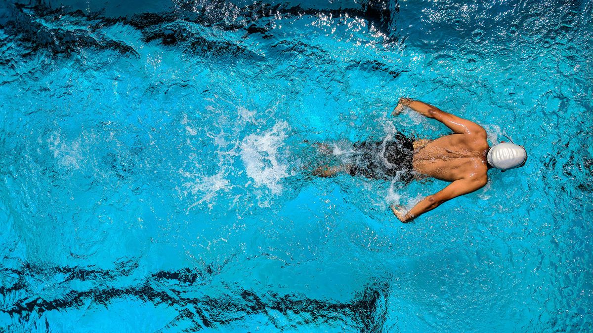 A man swimming in a pool