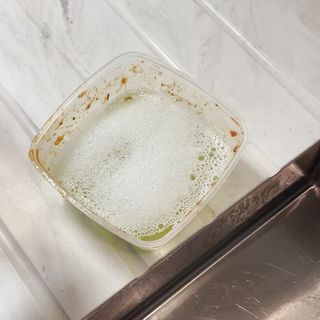 Cleaning food containers with washing up liquid and water