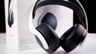 Sony Pulse 3D Wireless Headset leaning against its packaging on a white table