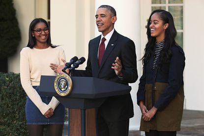 Sasha Obama, President Obama, and Malia Obama.