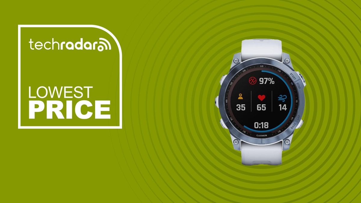 The Garmin Fenix 7 Sapphire Solar in white/silver on a green background with the TechRadar deals logo for lowest price