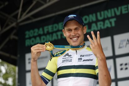 Luke Plapp (Jayco-AlUla) holds the gold medal of the Australian national road race champion for the third year in a row